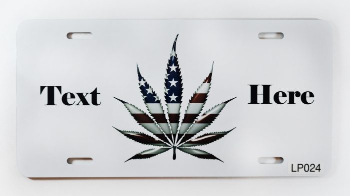 A white license plate with a marijuana leaf on it.