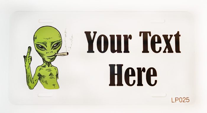 A sign with an alien smoking a cigarette.