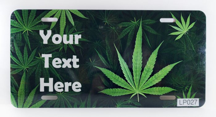 A marijuana leaf license plate with custom text.