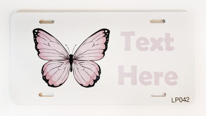 A pink butterfly with text on the bottom of it.