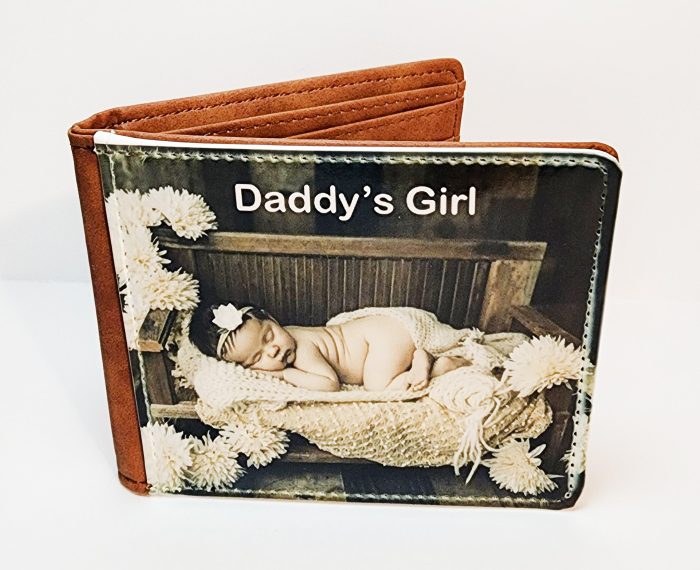 A wallet with a picture of a baby in it.