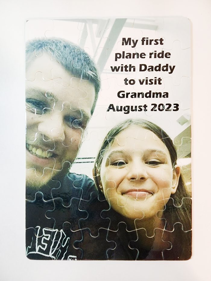 A puzzle with the words " my first plane ride with daddy to visit grandma august 2 0 2 3 ".