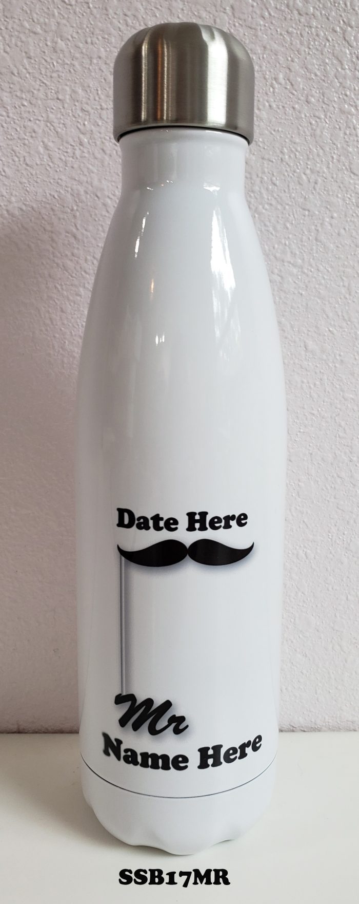 A white bottle with a mustache on it