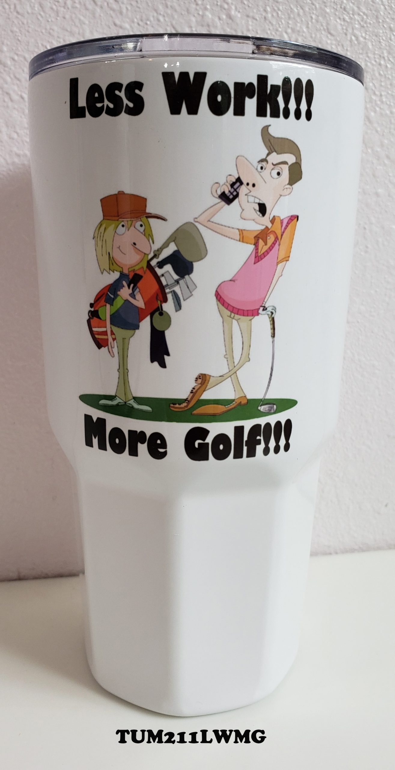 A cup that says more golf and is decorated with two cartoon characters.