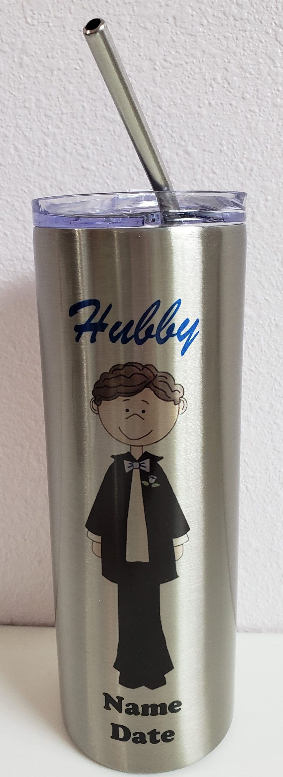 A close up of the name hubby on a metal cup