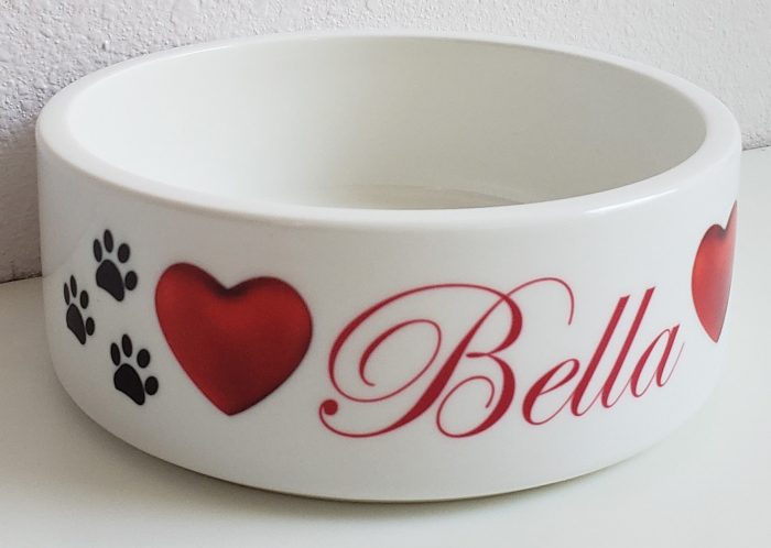 A bowl with the name bella written on it.