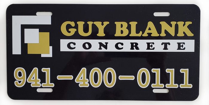 A black and gold sign with concrete written on it.