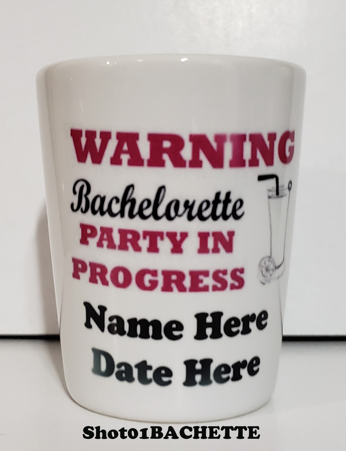 A bachelorette party mug with the name of the date and location.