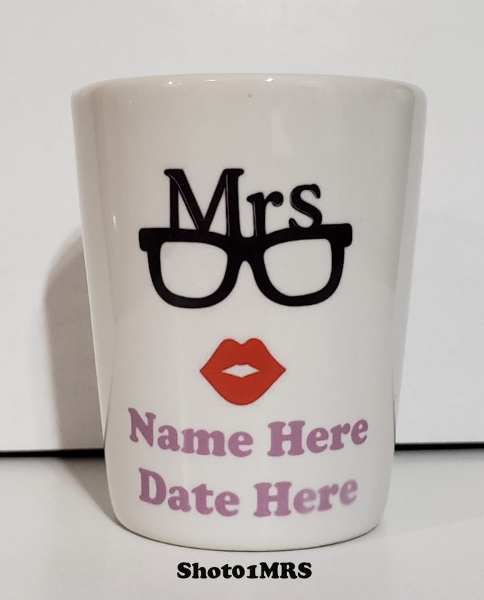 A cup that has a name and date on it.