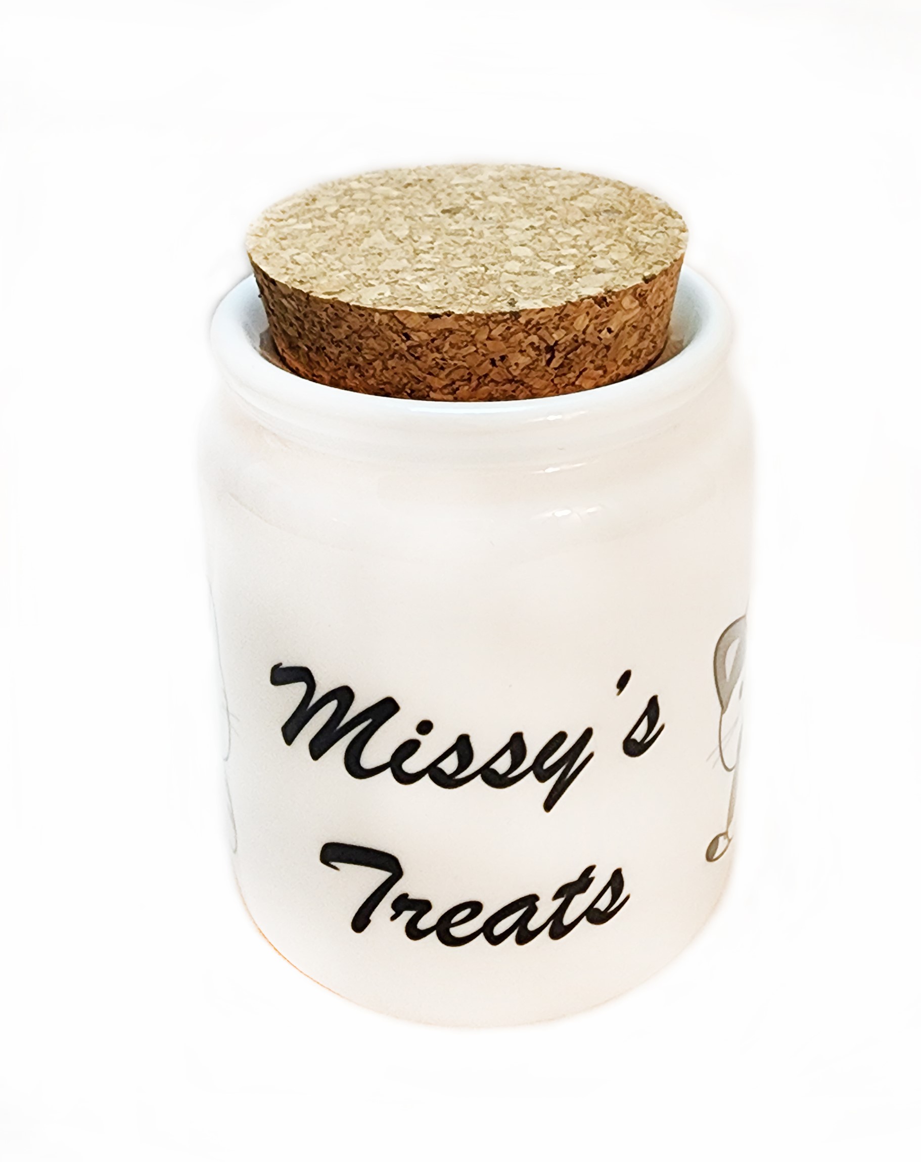 A white jar with a cork lid and the name " missy 's treats ".