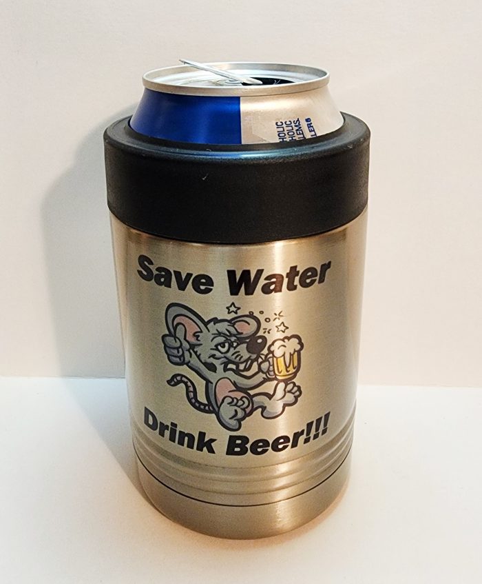 A can of beer is sitting on the side of a table.