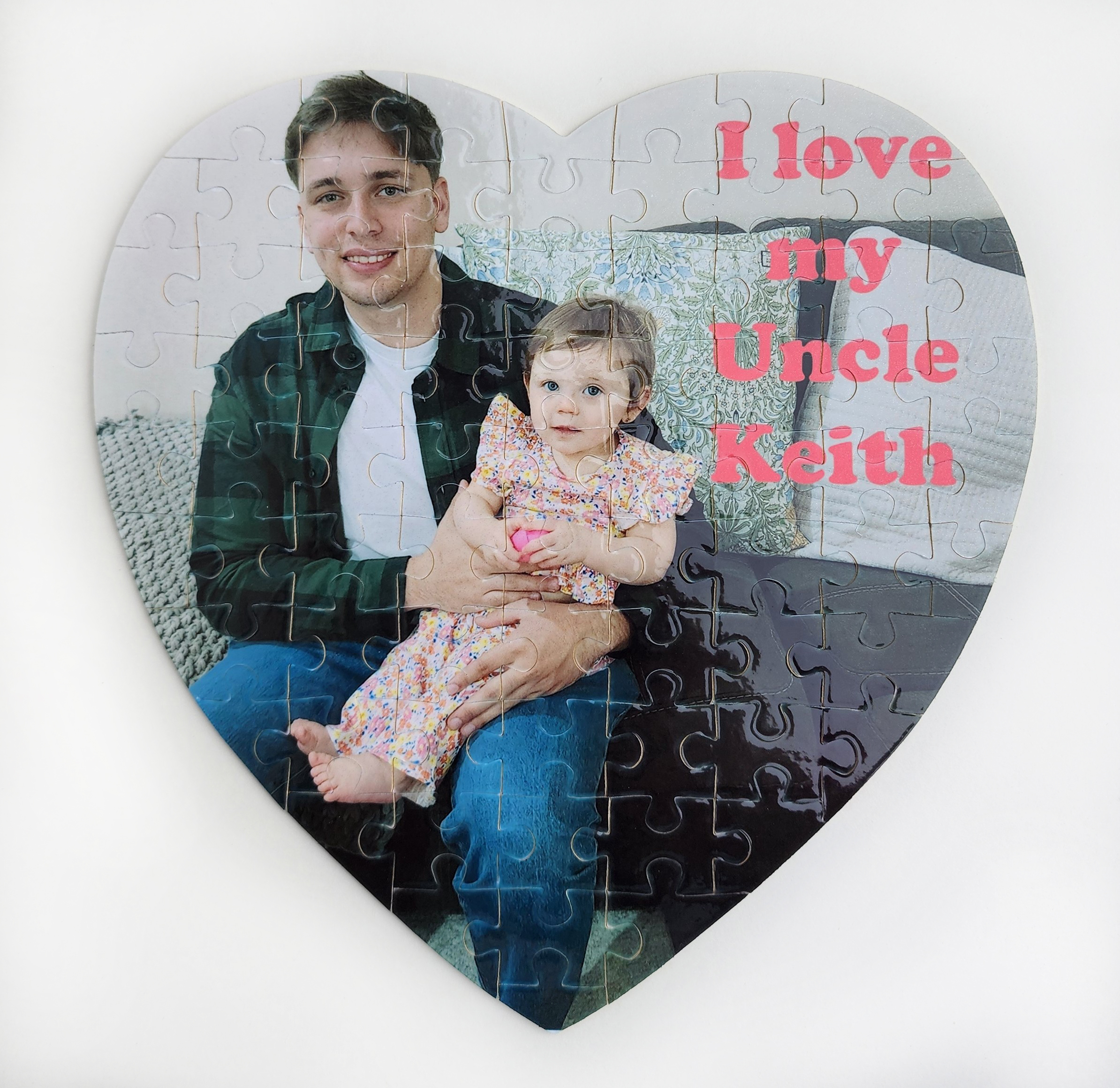 A heart shaped puzzle with the words " i love my uncle keith ".