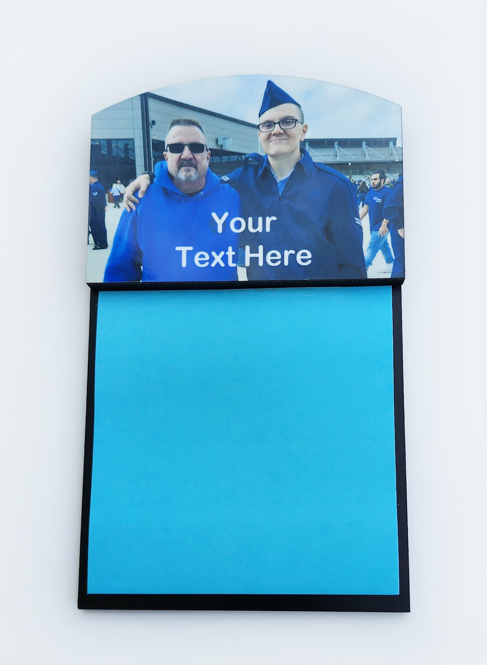 A blue sign with two men on it